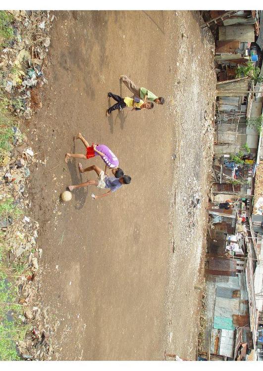 playing soccer (slums)