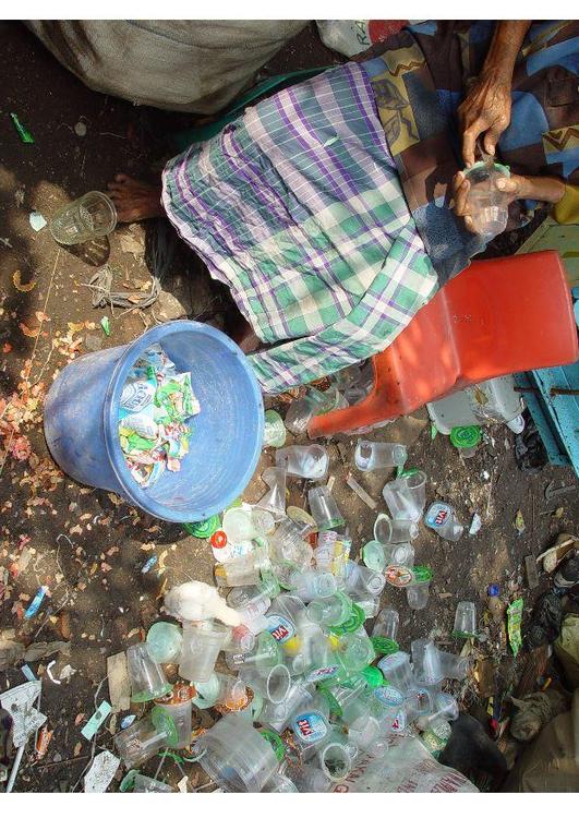 sorting through waste, slums in Jakarta