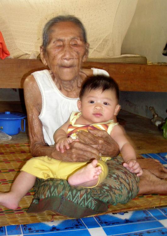 young and old, old woman with baby