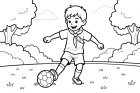 boy plays football in the park