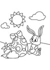 Coloring page Easter bunny with easter egg in the garden