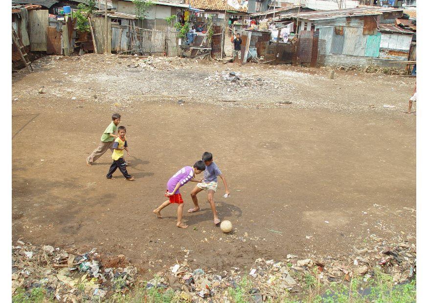 playing soccer (slums) Photo playing soccer (slums)
