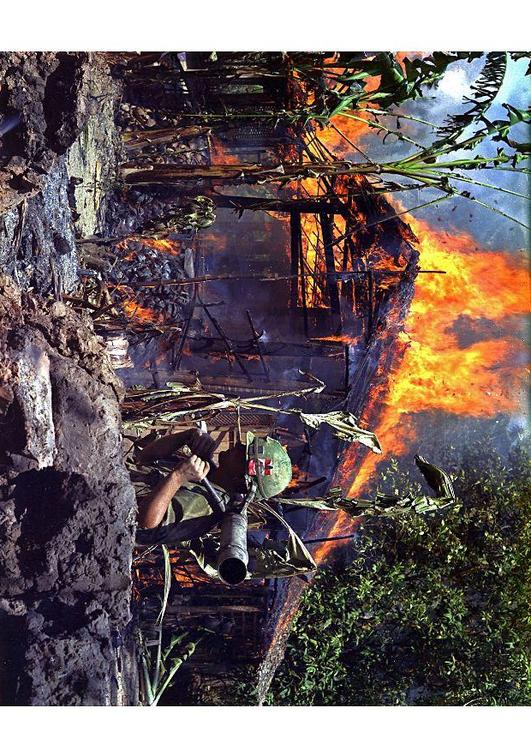 burning Vietcong basecamp