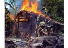 burning Vietcong basecamp