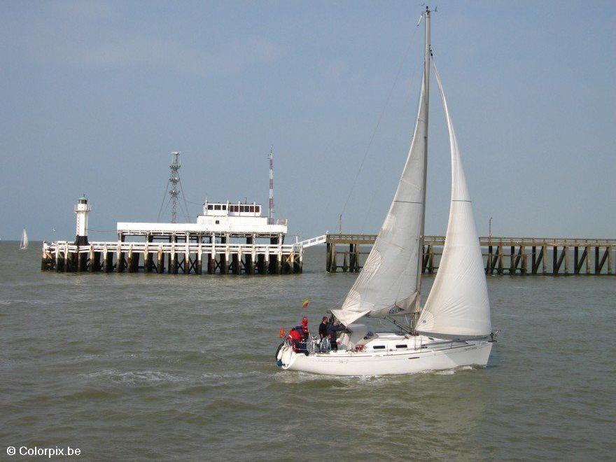 Photo pier with sailing boat
