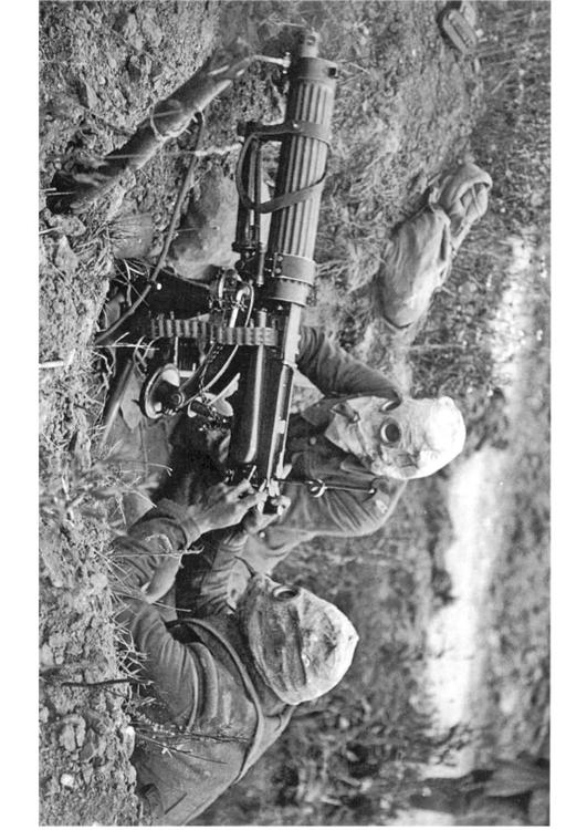 soldier with machine gun and gasmask