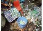 sorting through waste, slums in Jakarta