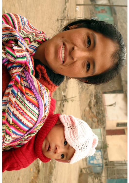 woman carrying baby on her back